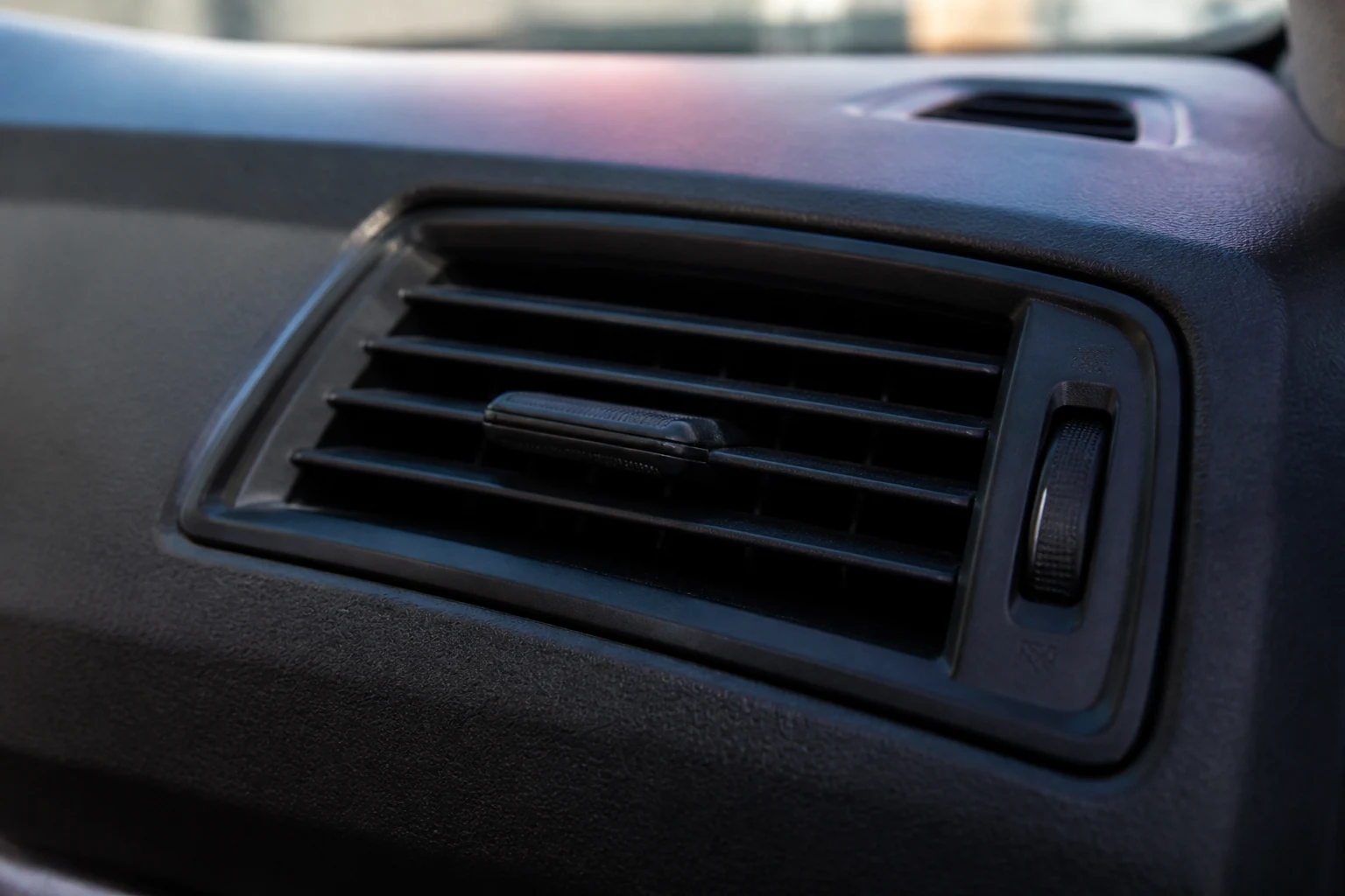 Clean car air vent showing weak cooling symptoms